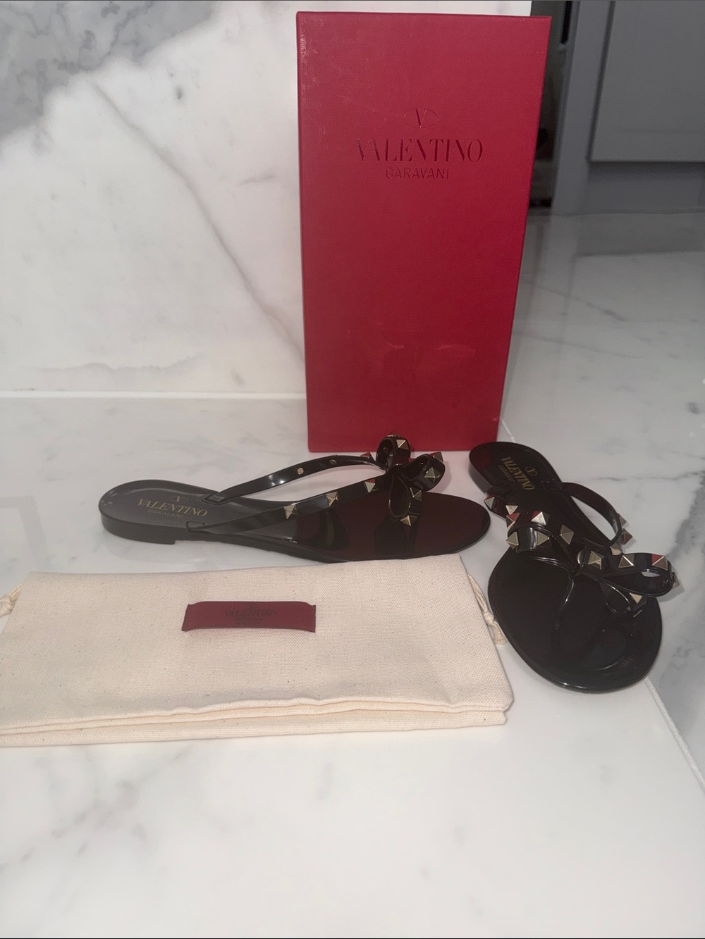 Valentino Garavani Black Jelly Bow Rockstud Thong Sandals